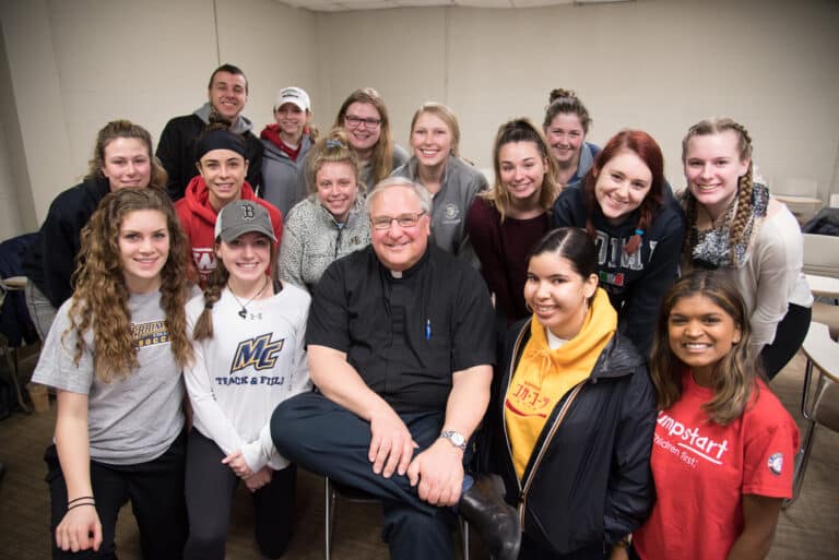 Fr. Raymond Dlugos, O.S.A. with 2017-2018 Austin Scholars