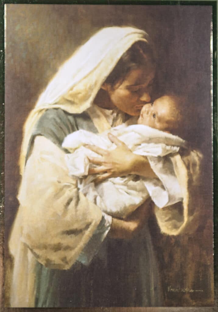 Baby mass card featuring "Kissing the Face of God."